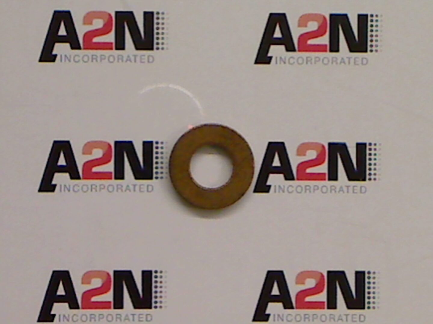 Metal washer on branded background.