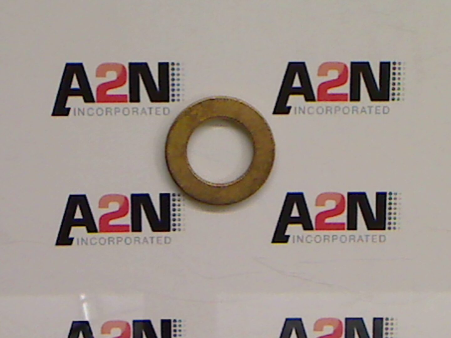 Brass washer on A2N branded background.