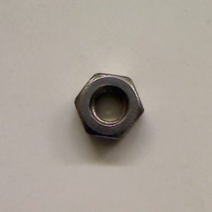 Metal hex nut on a plain background.