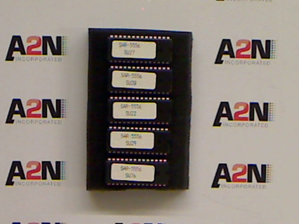 Five memory chips on a display background.